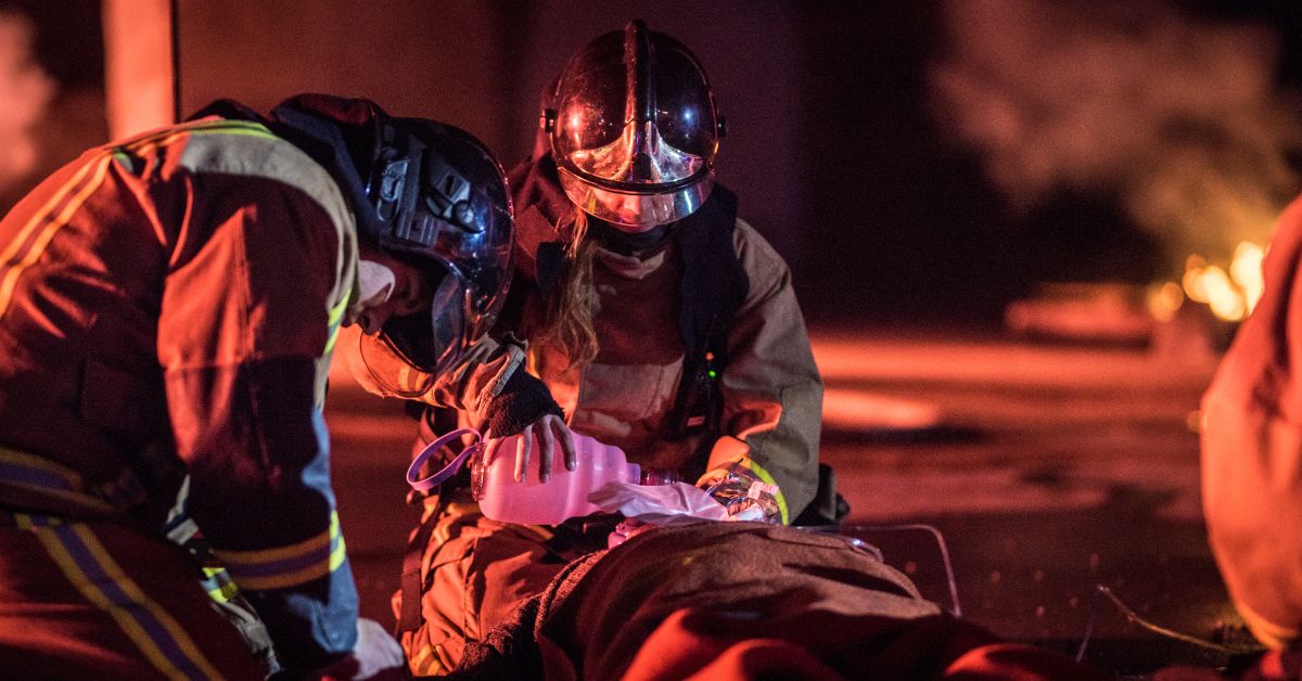 Firefighters doing first aid