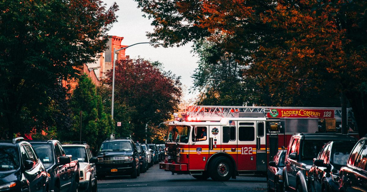 Fire engine under an autumn trees