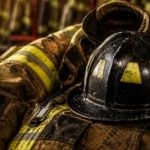 Firefighter turnout gear and helmet illustrating protective equipment discussed in the PFAS Alternatives Act.
